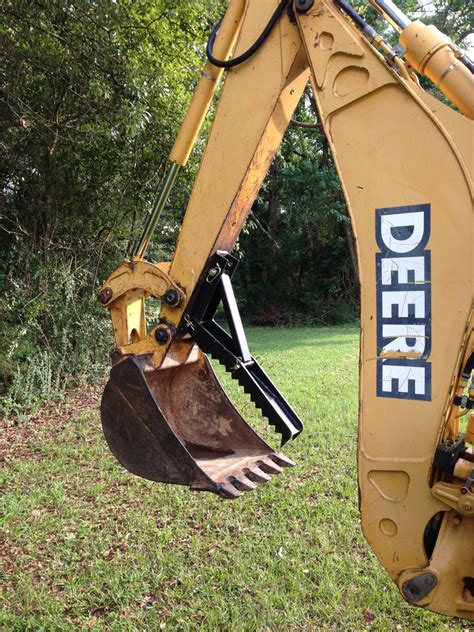 titan mini excavator thumb|titan attachments backhoe.